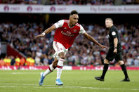 Arsenal's Pierre-Emerick Aubameyang celebrates scoring against Aston Villa during the English Premier League soccer match at the Emirates Stadium, London, Sunday Sept. 22, 2019. (Steven Paston/PA via AP)