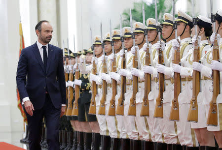 French Prime Minister Edouard Philippe attends a welcome ceremony hosted by China's Premier Li Keqiang at the Great Hall of the People in Beijing, China June 25, 2018. REUTERS/Jason Lee