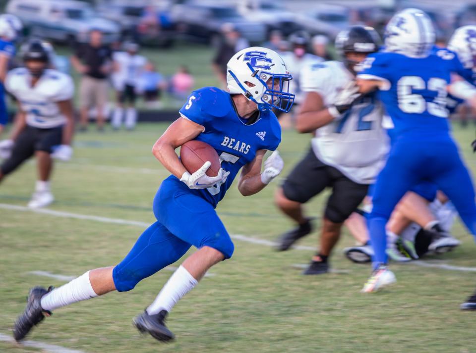 Spencer County High's Cameron Caldwell runs around the end against Collins High's. Sept. 9, 2022