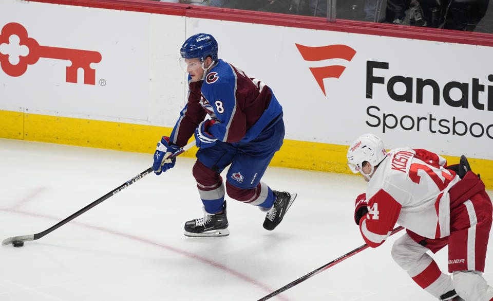 Colorado Avalanche defenseman Cale Makar, left, skates past Detroit Red Wings center Klim Kostin during the third period of an NHL hockey game Wednesday, March 6, 2024, in Denver. (AP Photo/David Zalubowski)