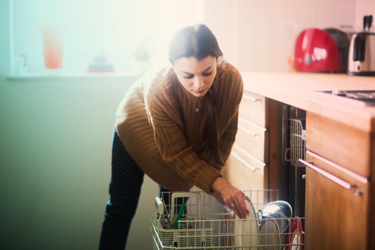 woman loading her dishwasher