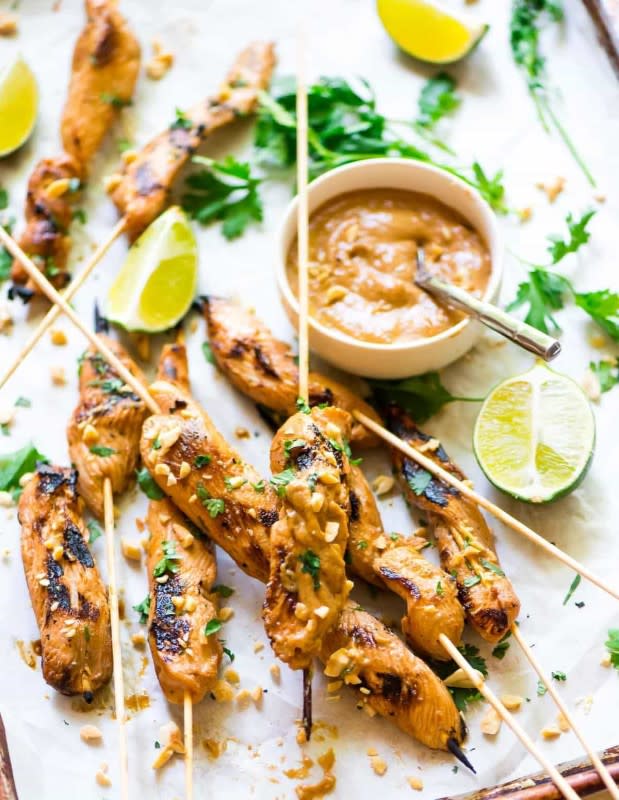 <p>Well Plated</p><p>Chicken marinated in Asian flavors, cooked and then dipped in an addicting peanut sauce.</p><p><strong>Get the recipe: <a href="https://www.wellplated.com/satay-chicken-peanut-dipping-sauce/" rel="nofollow noopener" target="_blank" data-ylk="slk:Chicken Satay;elm:context_link;itc:0;sec:content-canvas" class="link ">Chicken Satay</a></strong></p>