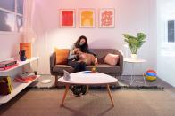 <p>Google Store Chelsea. A Home-themed Sandbox featuring a couch, coffee table, shelves and plants. A Nest Hub smart display sits on the coffee table.</p> 