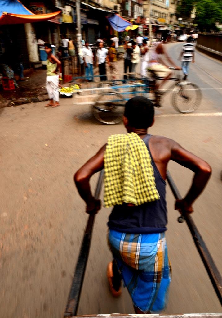 View from a hand-pulled rickshaw in Kolkata. They were brought to the city by Chinese businessmen for ferrying goods.