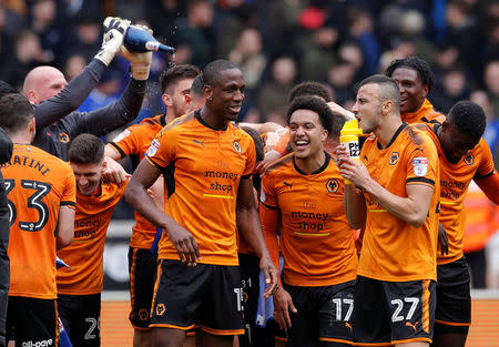 Soccer Football - Championship - Wolverhampton Wanderers vs Birmingham City - Molineux Stadium, Wolverhampton, Britain - April 15, 2018 Wolverhampton Wanderers' Willy Boly and team mates celebrate promotion after the match Action Images via Reuters/Andrew Couldridge