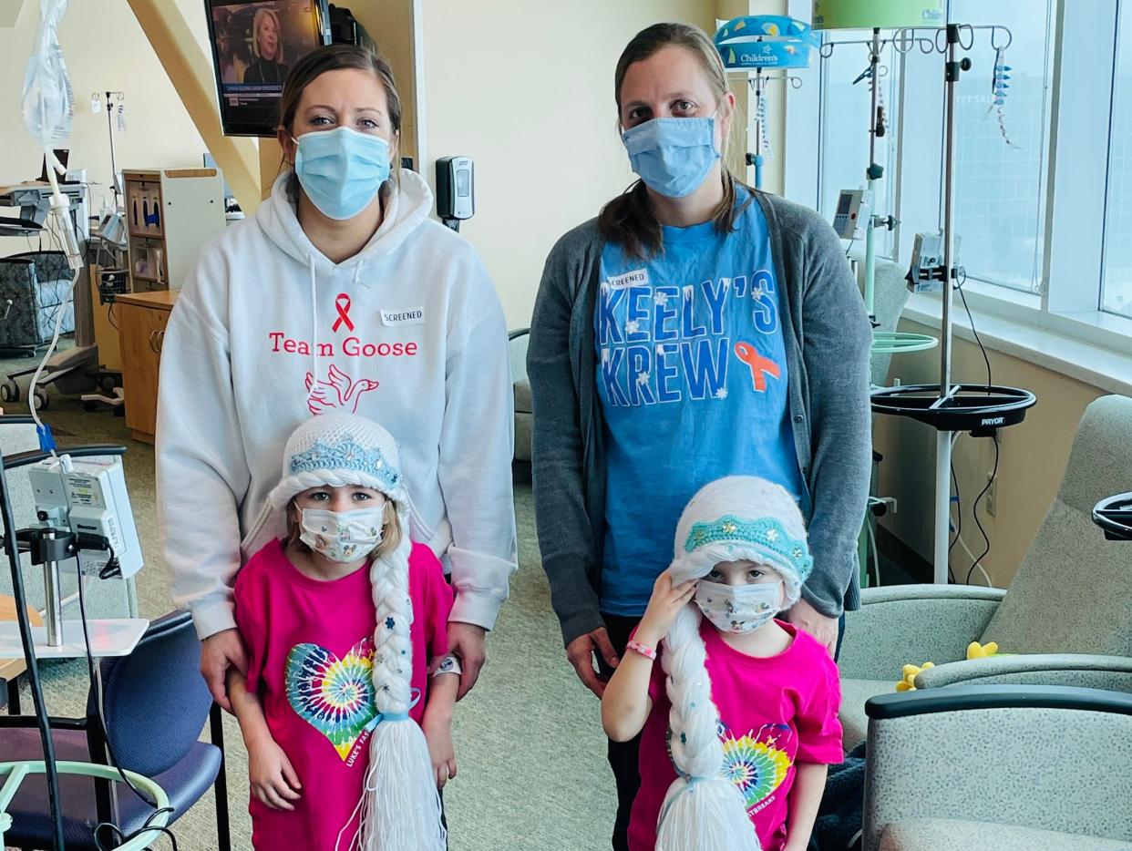 Kayla Werth with her daughter, and Cami Bergma with her daughter.