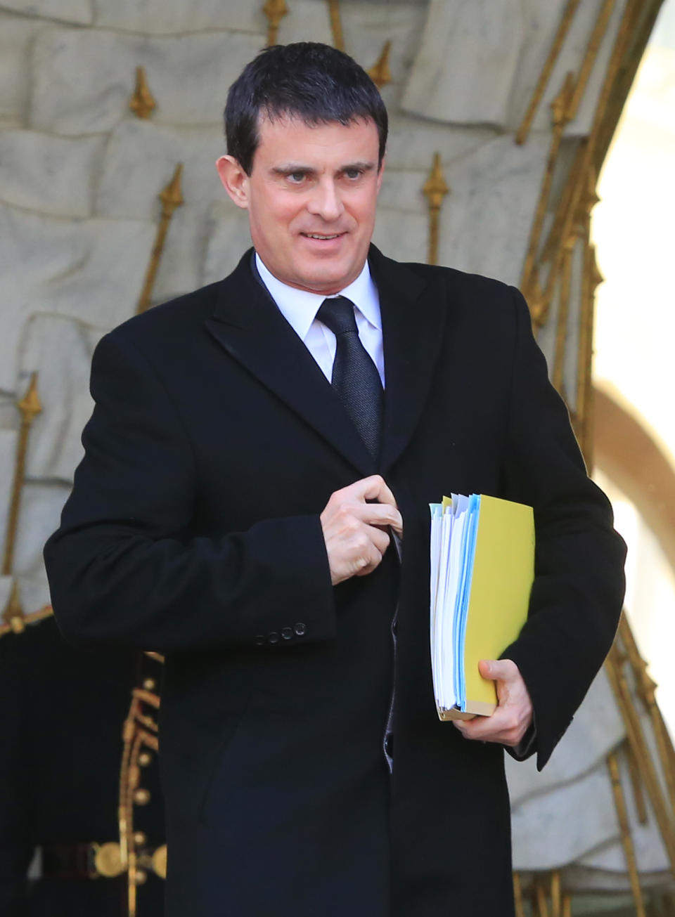 FILE - In this Jan. 8, 2014 file photo, French Interior Minister Manuel Valls leaves the Elysee Palace after the weekly cabinet meeting, in Paris. France's president has named 51-year-old Socialist Manuel Valls as the country's new prime minister, it was announced, Monday, March 31, 2014. In a prerecorded televised speech, Francois Hollande said Valls, the former interior minister, would lead a "combative government." (AP Photo/Jacques Brinon, File)