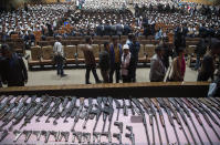 Cadres of different rebel groups sit during a surrender ceremony in Gauhati, India, Thursday, Jan. 23, 2020. More than 600 insurgents belonging to eight different rebel groups have surrendered to Indian authorities in this troubled northeastern state, responding to the government’s peace initiative to rejoin mainstream society. (AP Photo/Anupam Nath)