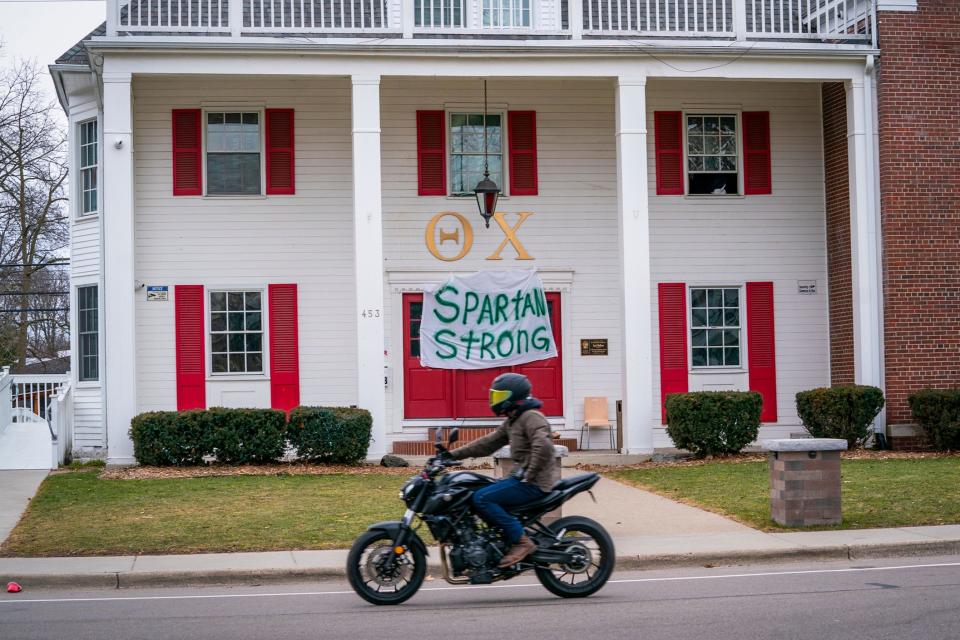 “Spartan Strong” signs are starting to pop up all over campus like this one outside of the Theta Chi fraternity house in East Lansing on Tuesday, Feb. 14, 2023 a day after a gunman killed three MSU students and injured five more people.