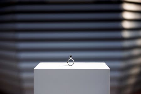 The Smog Free Ring made of compressed smog particles collected by the world's largest smog vacuum cleaner designed by Dutch artist and innovator Daan Roosegaarde as part of his The Smog Free Project is presented at D-751 art zone in Beijing September 29, 2016. REUTERS/Damir Sagolj