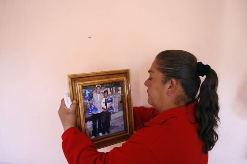 FILE PHOTO: Maria Guadalupe Guereca, mother of Sergio Hernandez, holds a picture of her son at their home in Ciudad Juarez