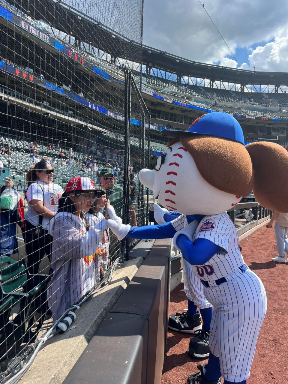 Mrs. Met greets fans before the game