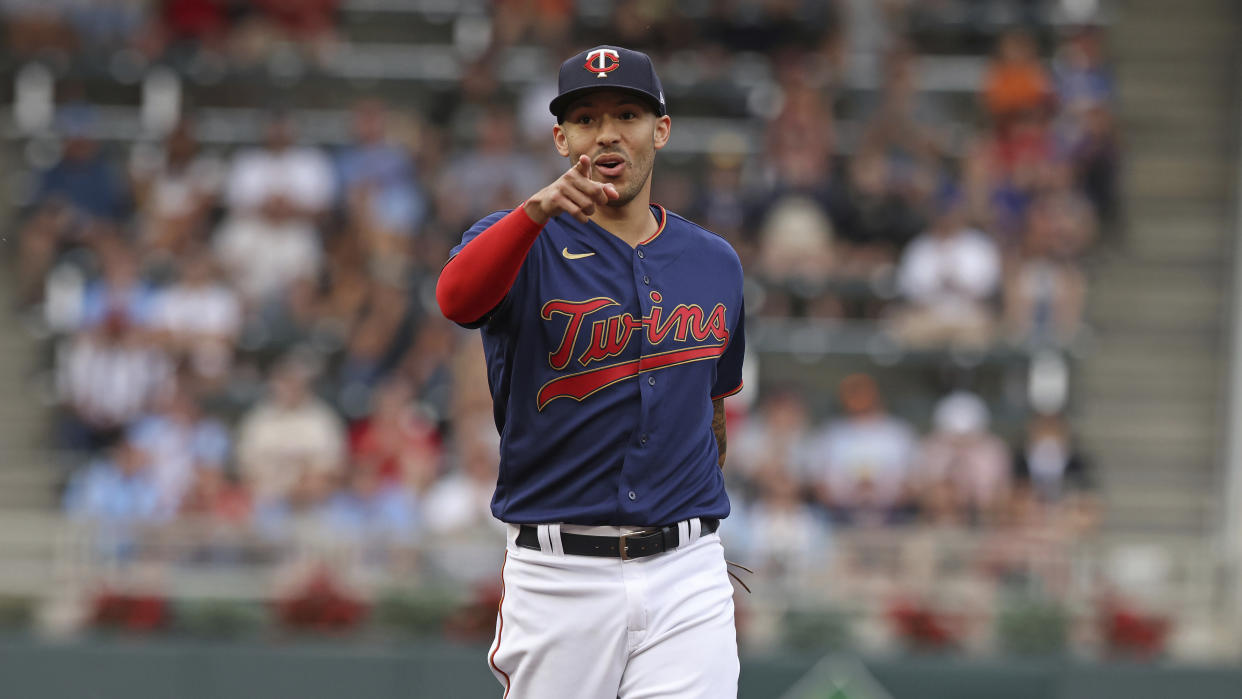 Minnesota Twins shortstop Carlos Correa (4) reacts after a play during the first inning of a baseball game against the Tampa Bay Rays, Friday, June 10, 2022, in Minneapolis. (AP Photo/Stacy Bengs)