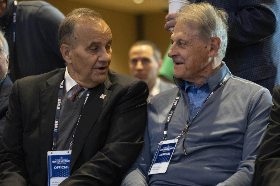 Joe Torre, left, talks to Tony La Russa before a news conference to announce the selection of Jim Leyland to the National Baseball Hall of Fame at the Major League Baseball winter meetings Monday, Dec. 4, 2023, in Nashville, Tenn. (AP Photo/George Walker IV)