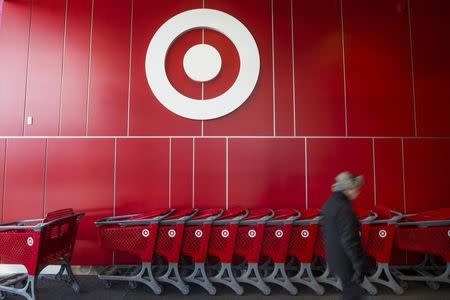 A man walks by shopping carts during the going-out-of-business sale at Target Canada in Toronto, February 5, 2015. REUTERS/Mark Blinch