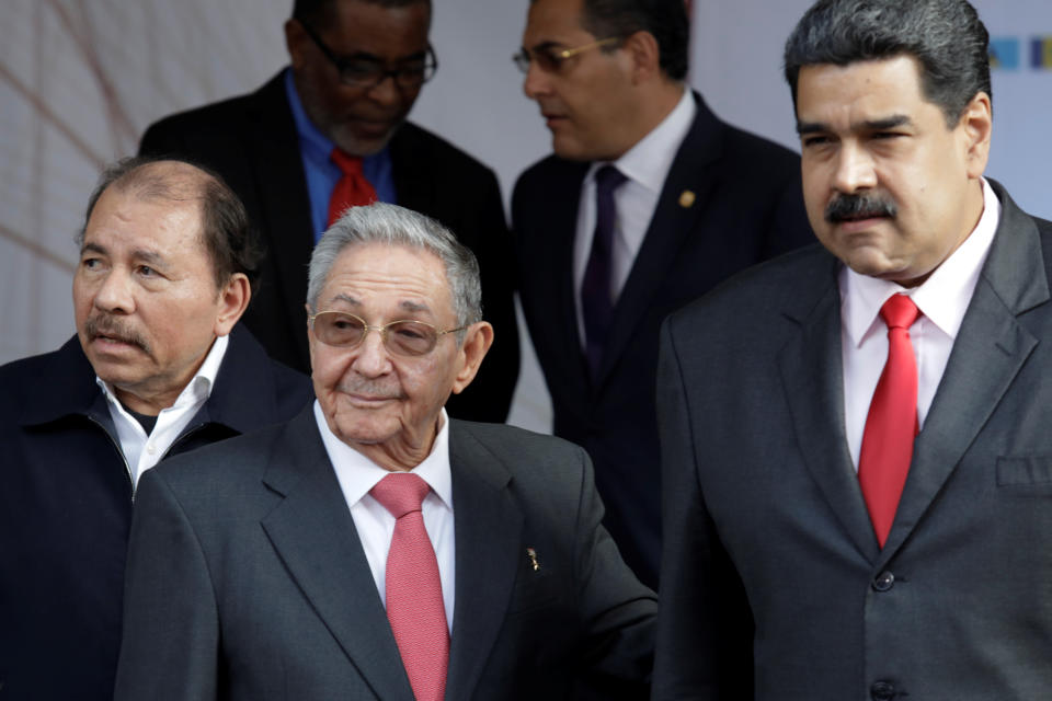 (L-R) Nicaragua's President Daniel Ortega, Cuba's President Raul Castro and Venezuela's President Nicolas Maduro pose for a family photo next to other regional leaders during an ALBA alliance summit to mark fifth anniversary of the death of Venezuela's late President Hugo Chavez in Caracas, Venezuela March 5, 2018. REUTERS/Marco Bello