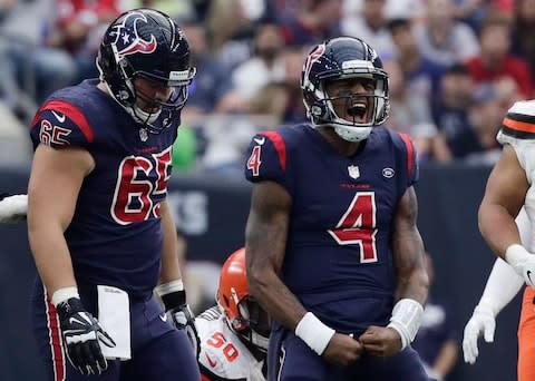 Houston Texans quarterback Deshaun Watson (4) celebrates after rushing for a first down against the Cleveland Browns during the second half of an NFL football game - Credit: AP Photo/Sam Craft