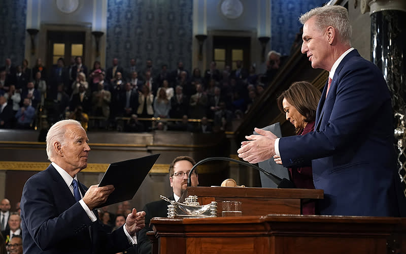 President Biden hands a copy of his State of the Union speech to Speaker Kevin McCarthy (R-Calif.) before delivering it on Feb. 7. <em>Associated Press/Jacquelyn Martin</em>