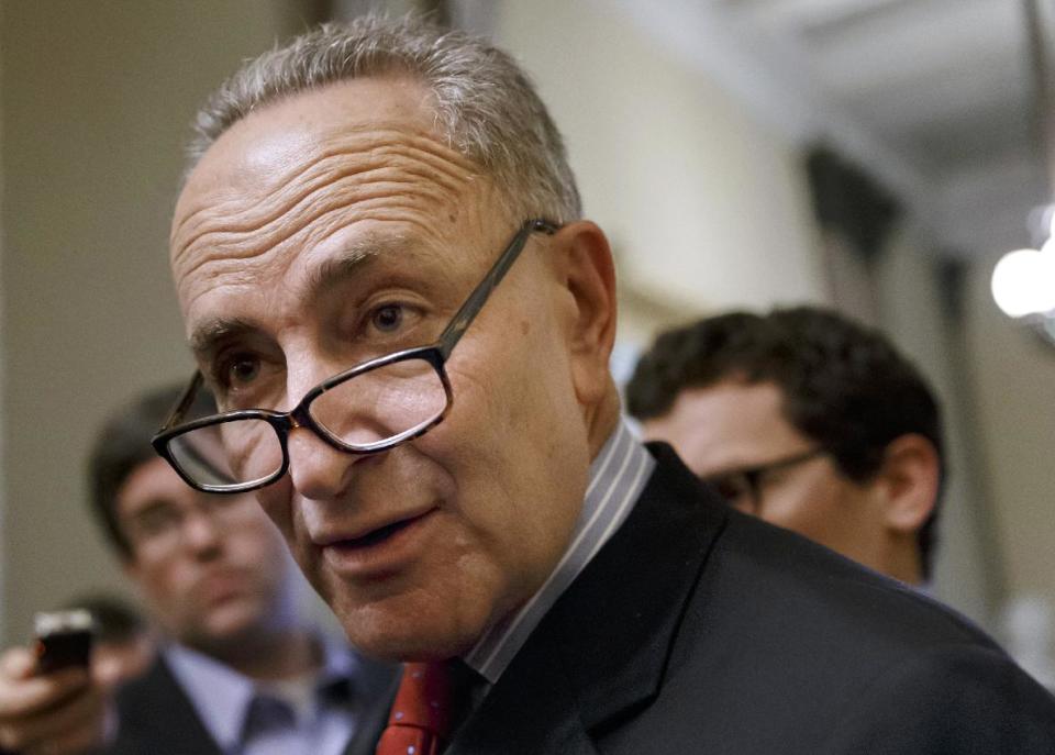 FILE - In this March 26, 2014, file photo, Sen. Charles Schumer, D-N.Y. speaks on Capitol Hill in Washington. Capping a three-month struggle, the Senate closed in Monday on passage of election-year legislation to restore jobless benefits for the long-term unemployed that expired late last year. Approval would send the legislation to a hostile reception in the House, where majority Republicans generally oppose it. (AP Photo/J. Scott Applewhite, File)