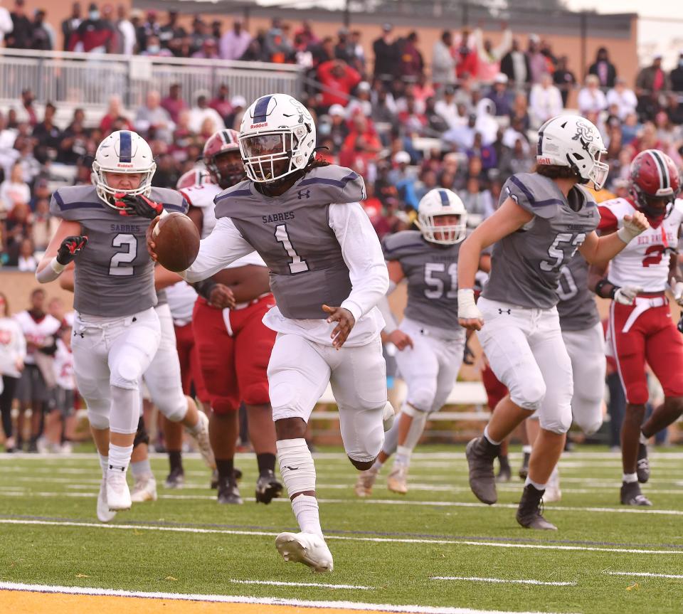 The Southside Christian Sabres take on the Bamberg-Ehrhardt Red Raiders in the SCHSL 1A State Championship football game, held at Benedict College in Columbia, Saturday evening, December 4, 2021. Southside Christian quarterback Ja'Corey Martin (1) runs the ball into the endzone for a touchdown in the first half.