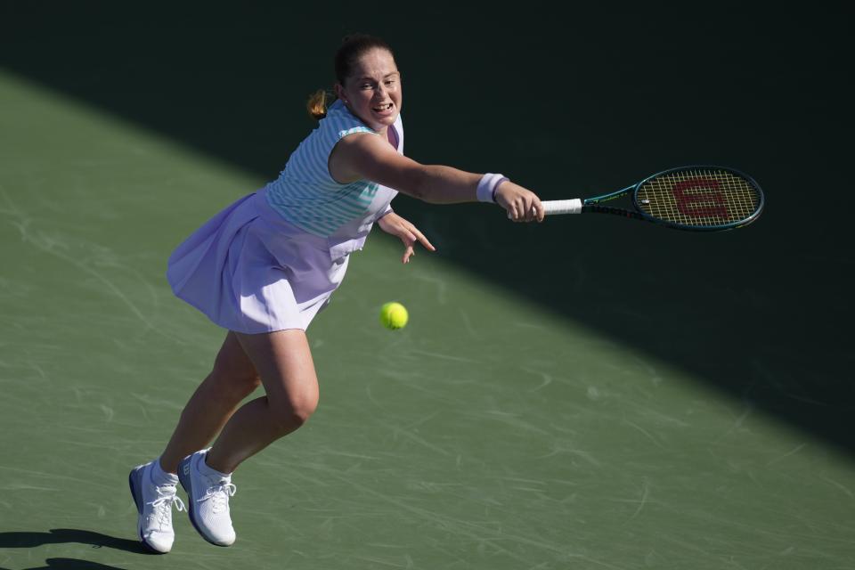 Jelena Ostapenko, of Latvia returns the ball to Xiyu Wang of China during a match of the Dubai Duty Free Tennis Championships in Dubai, United Arab Emirates, Monday, Feb. 19, 2024. (AP Photo/Kamran Jebreili)