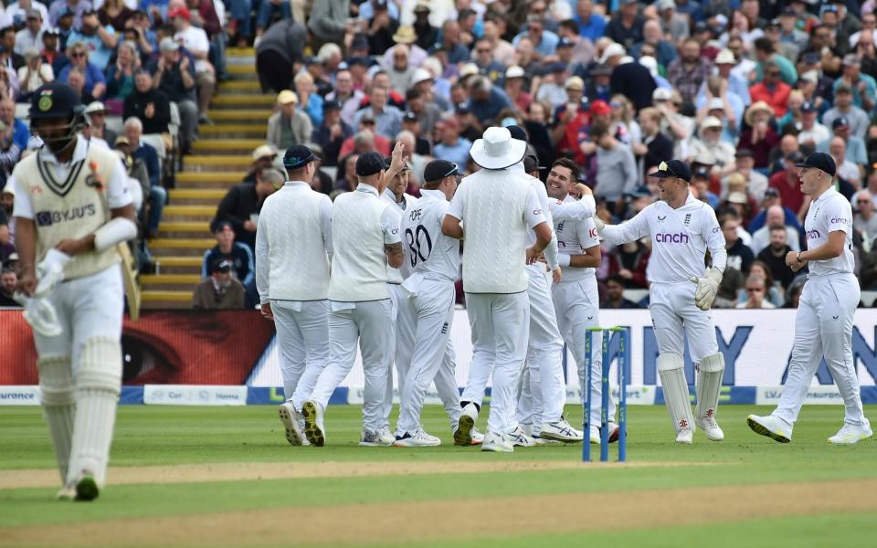 England's James Anderson, third right, celebrates with teammates the dismissal of India's Cheteshwar Pujara, left, during the first day of the fifth cricket test match between England and India at Edgbaston in Birmingham, England, Friday, July 1, 2022. - Rui Vieira /AP