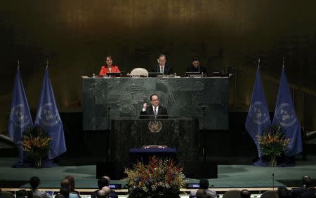 French President Francois Hollande delivers his remarks at the opening of the Paris Agreement signing ceremony on climate change at the United Nations Headquarters in Manhattan, New York, U.S., April 22, 2016. REUTERS/Mike Segar