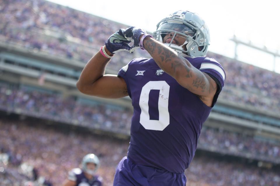 Kansas State senior wide receiver Jadon Jackson (0) reaches after scoring a touchdown early in the first quarter against Troy during Saturday’s game inside Bill Snyder Family Stadium.