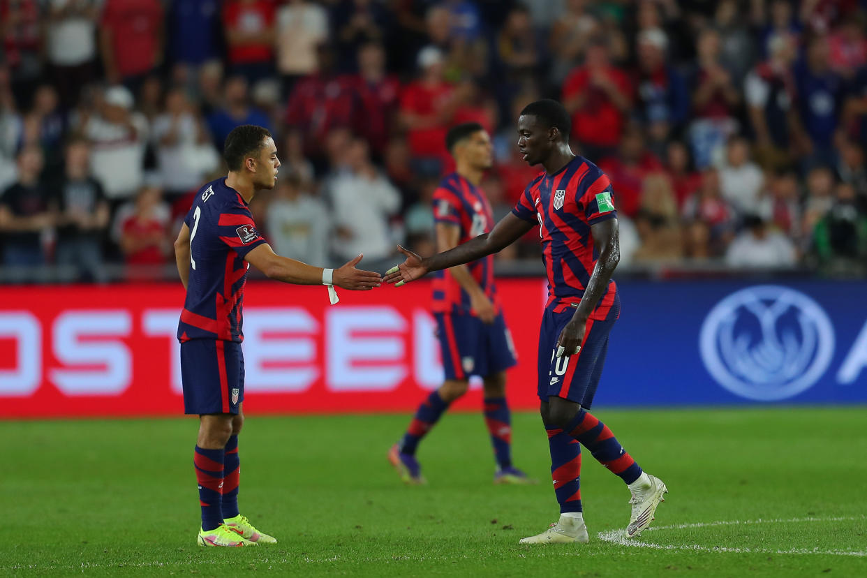 COLUMBUS, OH - OCTOBER 13: Tim Weah #20 of United States celebrates with his teammate Sergiño Dest #2 after scoring the second goal of his team during the FIFA World Cup Qatar 2022 qualifiers match between United States and Costa Rica at Lower.com Field on October 13, 2021 in Columbus, Ohio. (Photo by Omar Vega/Getty Images)