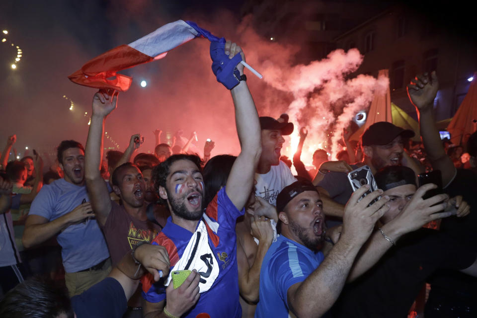 <p>French soccer fans celebrate on the final whistle after watching a live broadcast of the semifinal match between France and Belgium at the 2018 soccer World Cup, in Marseille, southern France,Tuesday July 10, 2018. France has advanced to the World Cup final for the first time since 2006 with a 1-0 win over Belgium. (AP Photo/Bob Edme) </p>