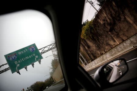 A traffic sign for Baltimore is seen on a highway near Baltimore, Maryland November 5, 2015. REUTERS/Carlos Barria