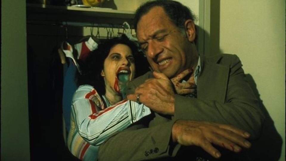 A woman with green oozing out of her mouth attacks a man in rabid strangest vampire movie