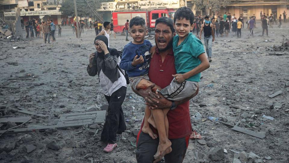 PHOTO: A Palestinian man walks away after an Israeli airstrike in Rafah, Gaza Strip, Nov. 7, 2023. (Eyad Baba/AP)