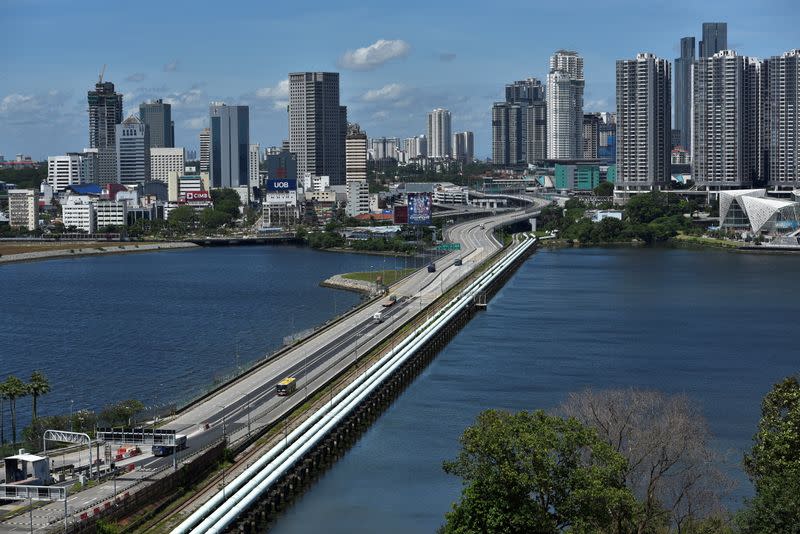 A Vaccinated Travel Lane (VTL) bus plies the causeway between Singapore and Malaysia, as it reopens after nearly two years amidst the coronavirus disease (COVID-19) pandemic, Singapore