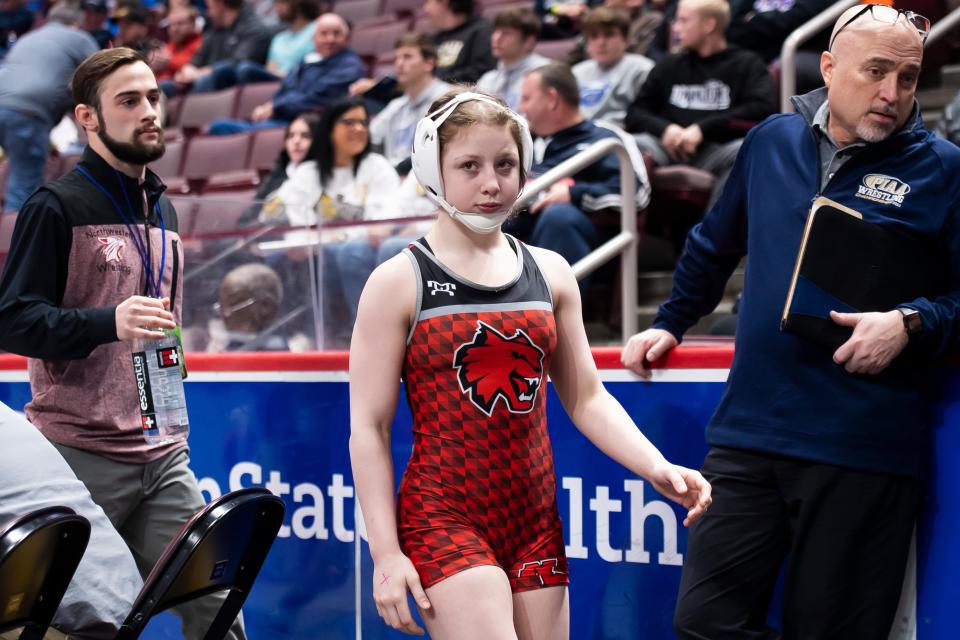 Northwestern's Sierra Chiesa walks to the mat to face Central Valley's Antonio Boni in a 107-pound first round bout at the PIAA Class 2A Wrestling Championships at the Giant Center on March 9, 2023, in Derry Township. Boni won by decision, 6-5.