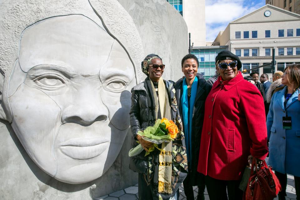 Architect Nina Cooke John, center, stands with the Harriet Tubman monument she designed titled 'Shadow of a Face' in Newark, New Jersey, on Thursday, March 9, 2023.