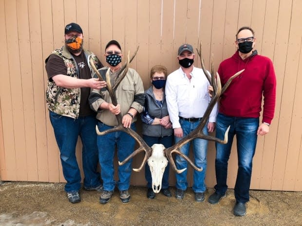 Official measurers with the Pope and Young Club pose with O'Shea's trophy antlers.