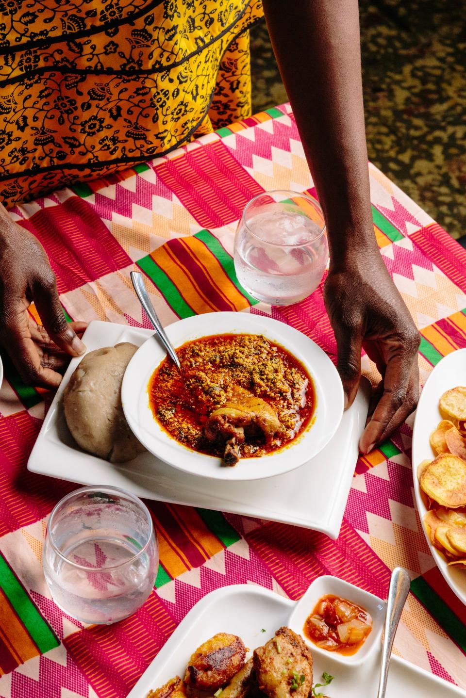 Adebajo getting ready to eat Iyan (pounded yam) with Egusi soup and chicken