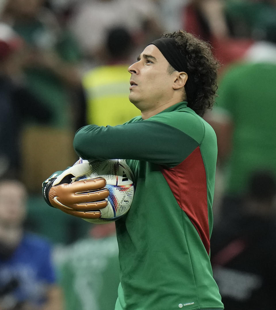 Mexico's goalkeeper Guillermo Ochoa warms up for the World Cup group C soccer match between Argentina and Mexico, at the Lusail Stadium in Lusail, Qatar, Saturday, Nov. 26, 2022. (AP Photo/Hassan Ammar)