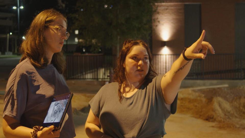 Emma Mannion, right, shows reporter Rachel de Leon where the security cameras were in Tuscaloosa Alabama. A Netflix documentary focuses on Mannion's story.