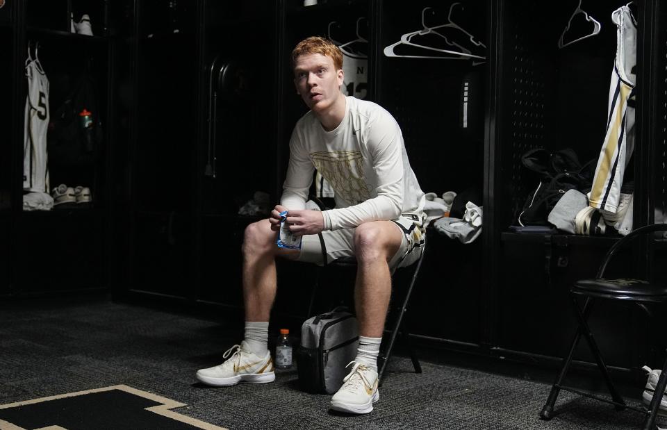 Noblesville Millers Aaron Fine sits in the locker room Tuesday, Feb. 20, 2024, ahead of the game against Mississinewa at Noblesville High School in Noblesville.