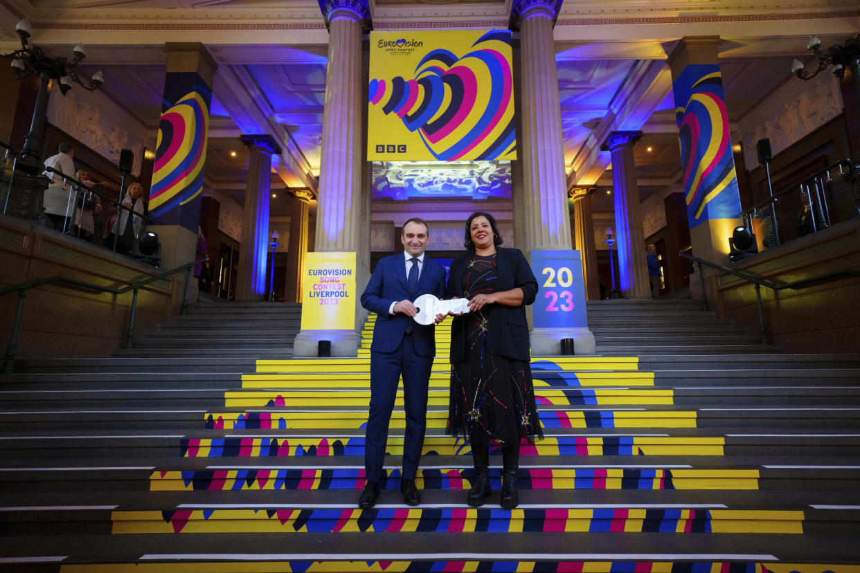 Mayor of Liverpool Joanne Anderson, right, is handed the Insignia of The Eurovision Song Contest by Mayor of Turin Stefano Lo Russo, Liverpool, England, Tuesday, Jan. 31, 2023. The official event at Liverpool's St George's Hall marks the start of Eurovision season with representatives from the previous and current nation's host city meeting to 