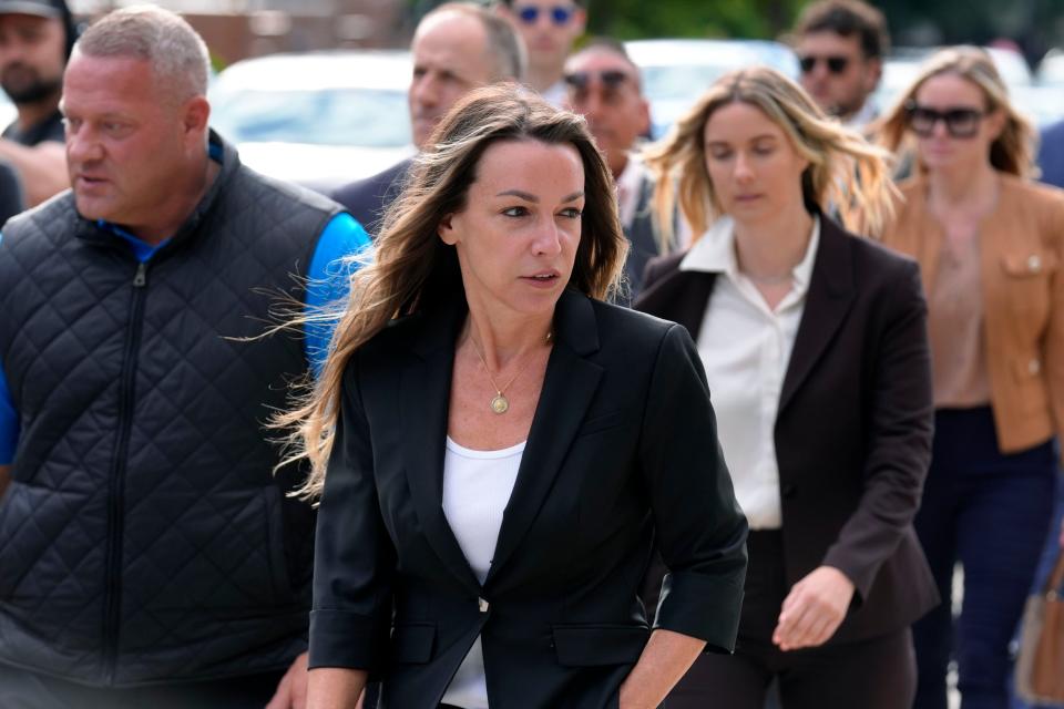 Karen Read, center, arrives at Norfolk Superior Court, Monday, July 1, 2024, in Dedham, Mass. Read is on trial, accused of killing her boyfriend Boston police Officer John O'Keefe, in 2022. The jury began deliberations in the trial Tuesday, June 25. (AP Photo/Steven Senne)