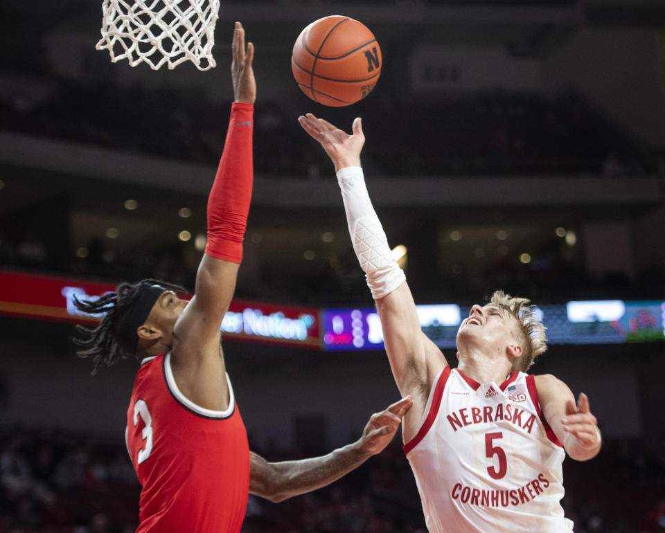 Ohio State's Eugene Brown III, left, defends against Nebraska's Sam Griesel during the first half of an NCAA college basketball game Wednesday, Jan. 18, 2023, in Lincoln, Neb. (Justin Wan/Lincoln Journal Star via AP)