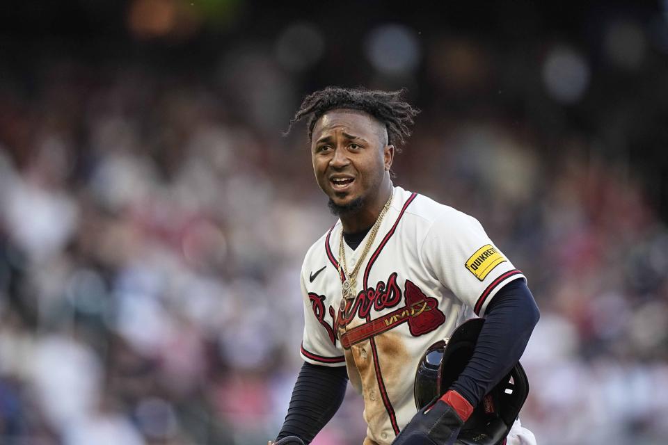 Atlanta Braves' Ozzie Albies (1) reacts after being out at second against the Philadelphia Phillies during the second inning of Game 1 of a baseball NL Division Series, Saturday, Oct. 7, 2023, in Atlanta. (AP Photo/Brynn Anderson)