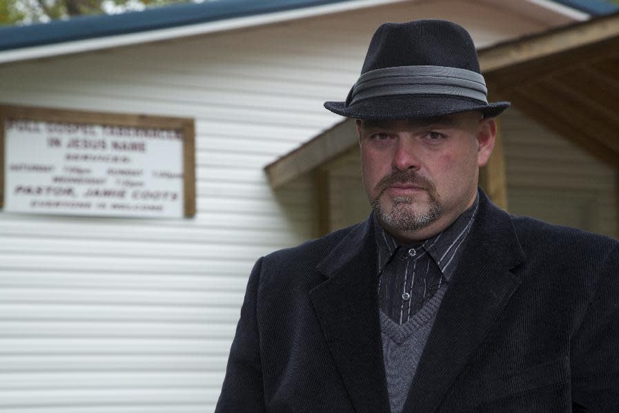 In this 2013 photo provided by National Geographic Channel, Jamie Coots, a pastor in Middlesboro, Ky., who appeared on the National Geographic television reality show "Snake Salvation," poses for a photo. Coots died Sunday, Feb. 16, 2014, after being bitten by a snake. (AP Photo/Courtesy National Geographic Channel)