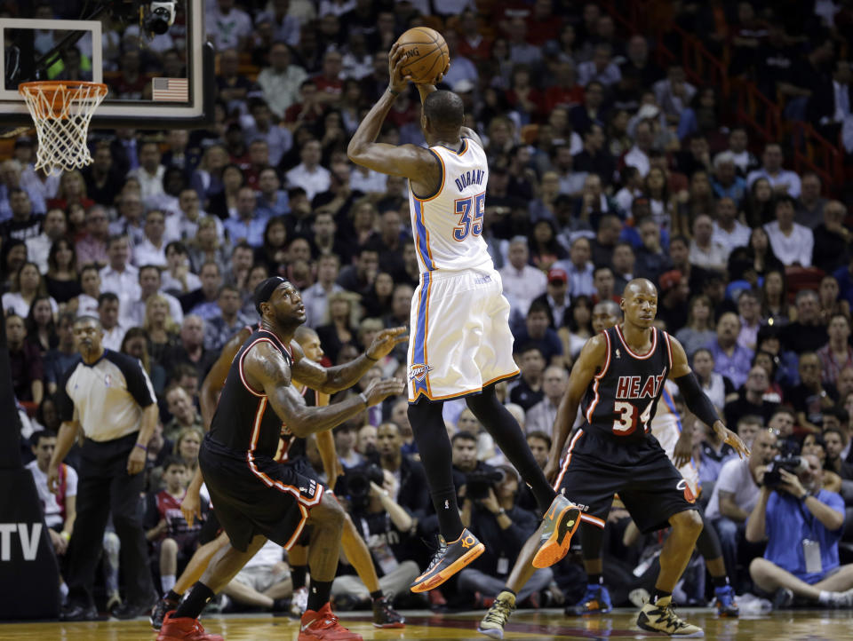 Oklahoma City Thunder small forward Kevin Durant (35) shoots against Miami Heat small forward LeBron James (6) and guard Ray Allen (34) during the second period of an NBA basketball game in Miami, Wednesday, Jan. 29, 2014. (AP Photo/Alan Diaz)