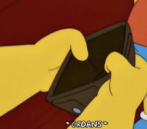 Two characters from The Simpsons, Bart and Homer, look into Homer's empty wallet with a caption "*GROANS*" below