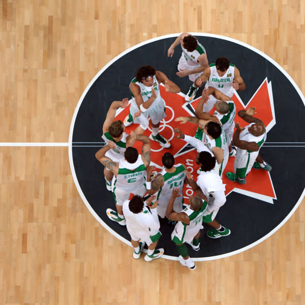 LONDON, ENGLAND - JULY 29: The Brazil Basketball team celebrate after defeating the Australians in their Men's Basketball game on Day 2 of the London 2012 Olympic Games at the Basketball Arena on July 29, 2012 in London, England. (Photo by Rob Carr/Getty Images)