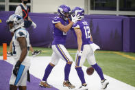 Minnesota Vikings wide receiver Chad Beebe (12) celebrates with teammate Bisi Johnson, left, after catching a 10-yard touchdown pass during the second half of an NFL football game against the Carolina Panthers, Sunday, Nov. 29, 2020, in Minneapolis. The Vikings won 28-27. (AP Photo/Bruce Kluckhohn)